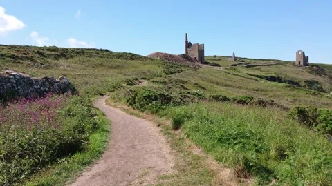 Walking toward tin and copper mine in cornish countryside of cornwall uk Stock Footage 279434223