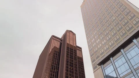 Walking Toward Urban Skyscraper While Holding Upward Angle of City Buildings Stock Footage 311054320