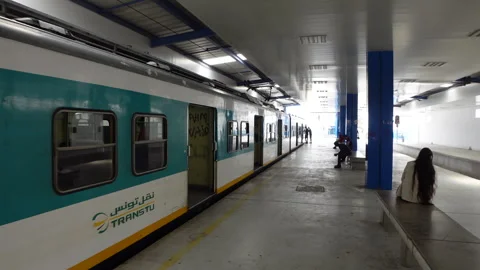 Walking towards commuter train on platform in Tunis Tunisia Stock Footage 345036049