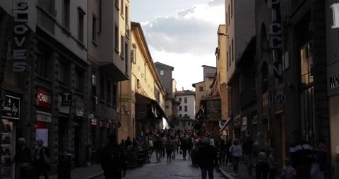 Walking towards Ponte Vecchio in Florence at sunset Stock Footage 197491759