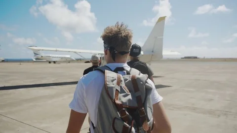 Walking Towards A Small Plane Stock Footage 75277728