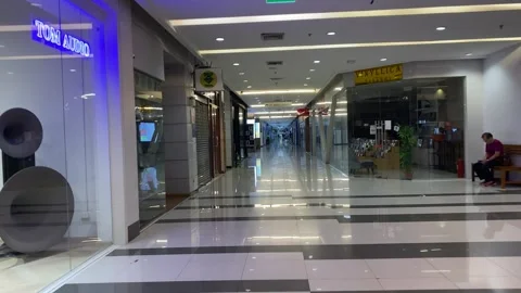 Walking towards storefront hall early morning at Fortune Town Mall, Thailand Video stock 248818092