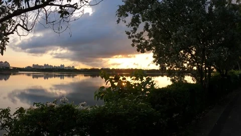 Walking towards Sunrise/Sunset across River Stock Footage 156653260