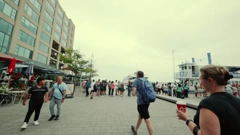 Walking towards tour boat queue at Toronto harbour, graded 4k Stock Footage 282152988