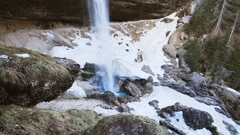 Walking towards a waterfall surrounded by ice Stock Footage 103222622