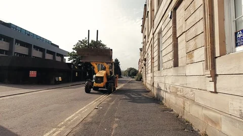 Walking towards a yellow tractor Stock Footage 160437318