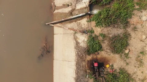 Walking tractor engine draining water Stock Footage 117326717