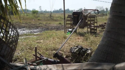 Walking tractor engine draining water Stock Footage 121507892
