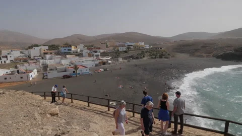 Walking the trail and viewpoint over Ajuy Beach towards the Ajuy Caves Stock Footage 268926288