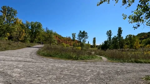 Walking trail junction at evergreen brickworks hiking jogging biking autumn Stock Footage 217440552