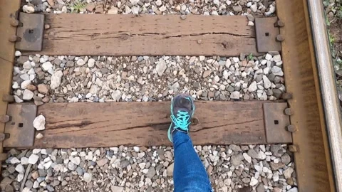 Walking into the train tracks Stock Footage 146035304