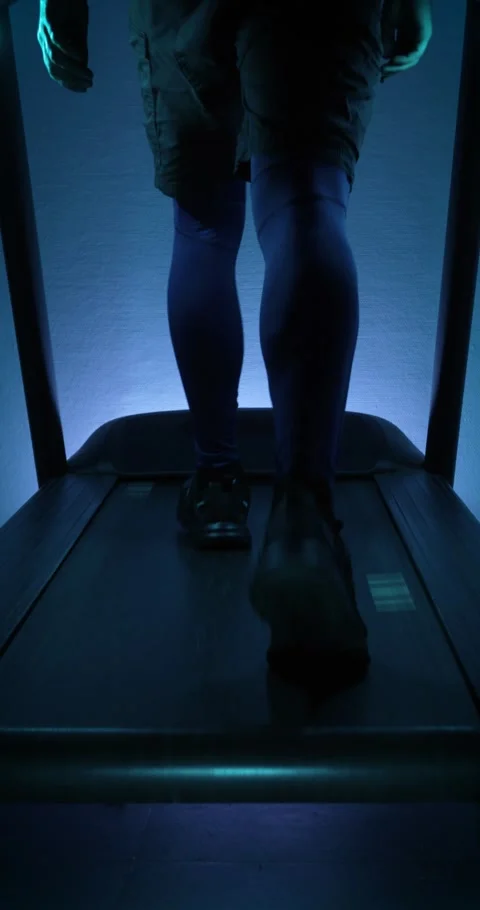 Walking on a treadmill. Vertical video Stock Footage 314502293