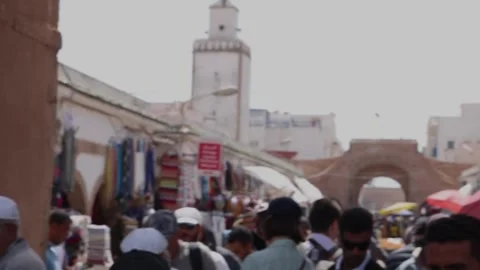 Walking trough a crowd medina, mosque in the back Stock Footage 238628472