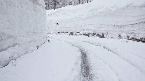 Walking trough extremely deep snow to suv car Stock Footage 103223314