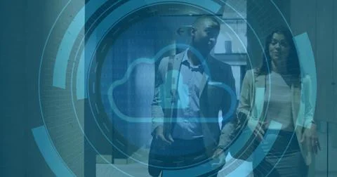 Walking two business pros talking down office corridor in suit and blazer, HU Stock Photos
