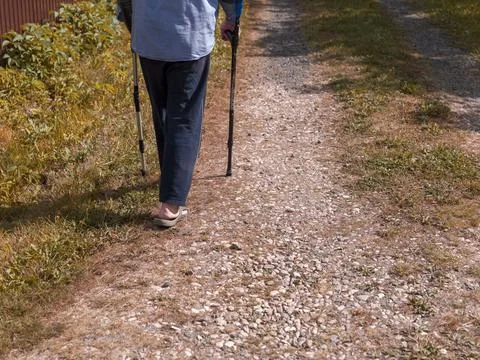 Walking with two sticks 写真素材