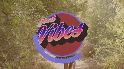Walking two women down warm path lined with shrubs, showing growing good Vibes Stock Footage 332316561