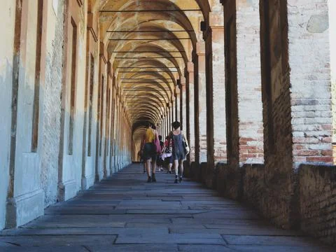 Walking under the arcades Stock Photos