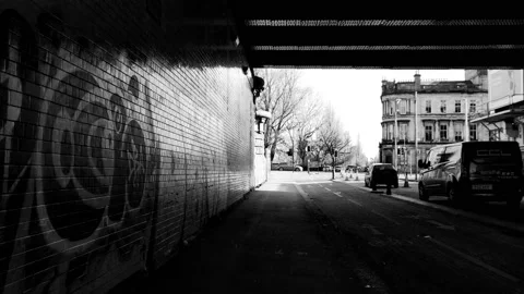 Walking under a city bridge covered with graffiti Stock Footage 171801329