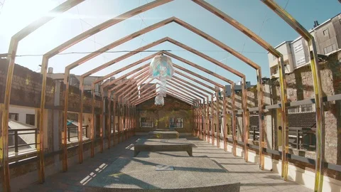 Walking under old house frames on a shining beautifil day Video stock 103402119