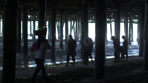Walking under pier Stock Footage 32191764