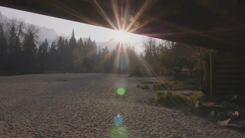 Walking Under Swinging Bridge with Sun in Yosemite Stock Footage 101445495