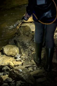 Walking in an underground cave with water Foto stock