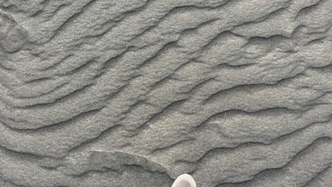 Walking on a Unique Texture of Volcanic Sand Carved by Wind Breeze 스톡 동영상 342686337