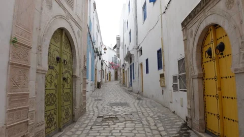 Walking uphill through beautiful narrow streets of old medina in Tunis Tunisia Stock Footage 319830226