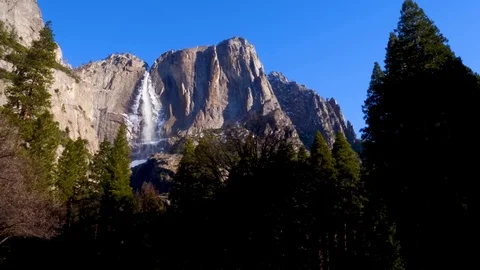 Walking to Upper Yosemite Falls Waterfall Through Tree 스톡 동영상 87852267