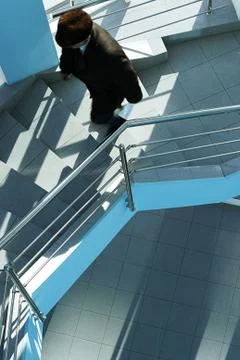 Walking upstairs Stock Photos