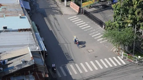 Walking vendor and aerial view road and residential in rural  vietnam Stock Footage 69820005