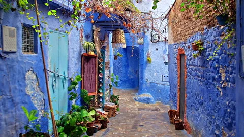 Walking view of empty blue walled shopping street, Chefchaouen, Morocco Stock Footage 311808171