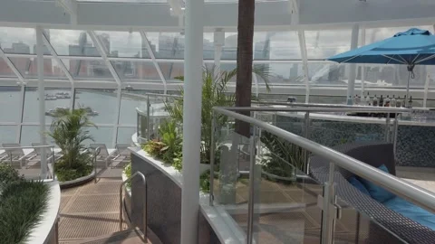 Walking view on the top deck with indoor swimming pool under glasses dome a.. Stock Footage 322117426