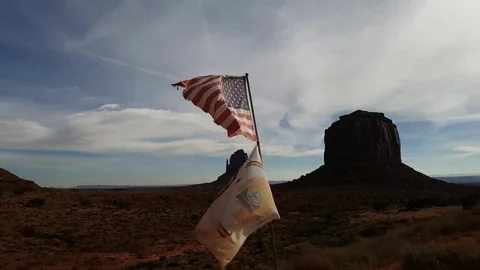 Walking view of USA flag waving in front of the legendary mountain tops, of.. Stock Footage 72405722