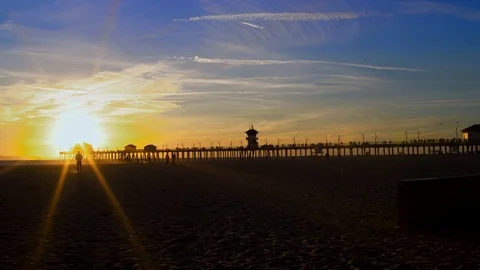 Walking walking away from sunset at beach, 4K Stock Footage 101002329