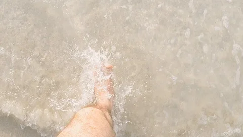 Walking into the water in Dubai Stock Footage 99608690