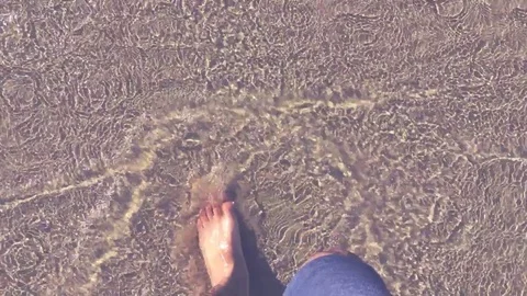 Walking on the water with a slow mo reverse effect. Stock Footage 108587588