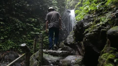 Walking in waterfall Stock Footage 207976920