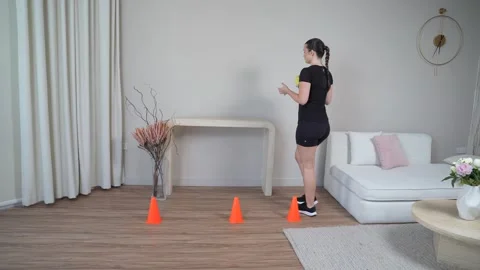 Walking Weave Through Cones with Ball Toss Stock Footage 314190667