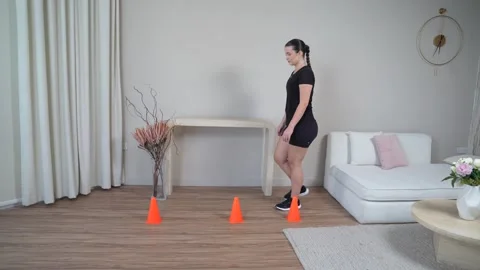 Walking Weave Through Cones Forward and Backward Stock Footage 314190638