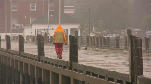 Walking on the Wharf in the Rain. Video stock 57251589