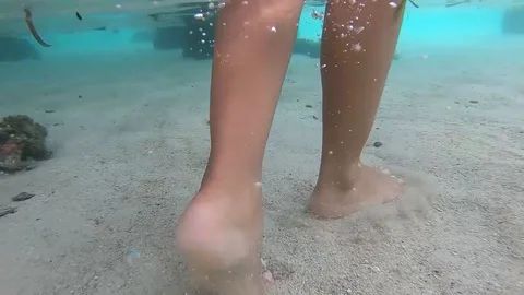 Walking on white sand on shallow waters (no sound) Stock Footage 122544986