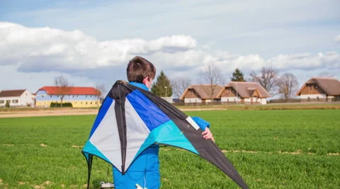 Walking with wind kite on back 4K Stock Footage 49864299
