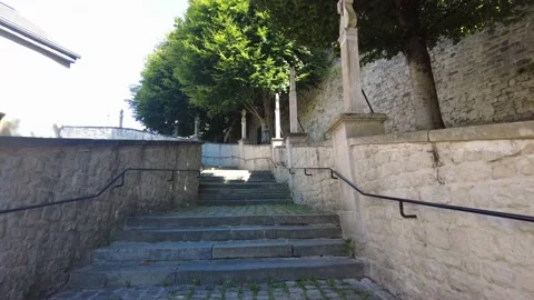 Walking up winding stone steps Stock Footage 228945180