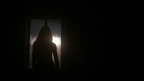Walking to the window Stock Footage 101035622