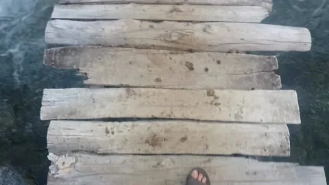 Walking on a wooden bridge Stock Footage 131612239