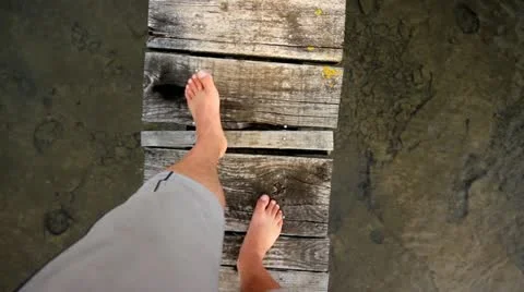 Walking on wooden dock Stock Footage 12565908
