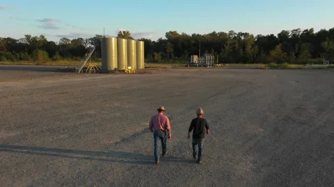 Walking to Work in Oilfield Stock Footage 333692723