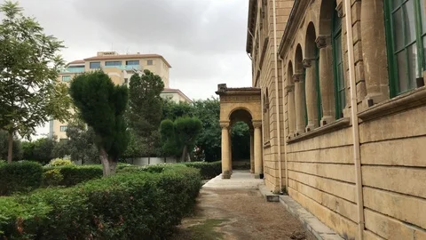 Walking in the yard of an old building Stock Footage 89753820